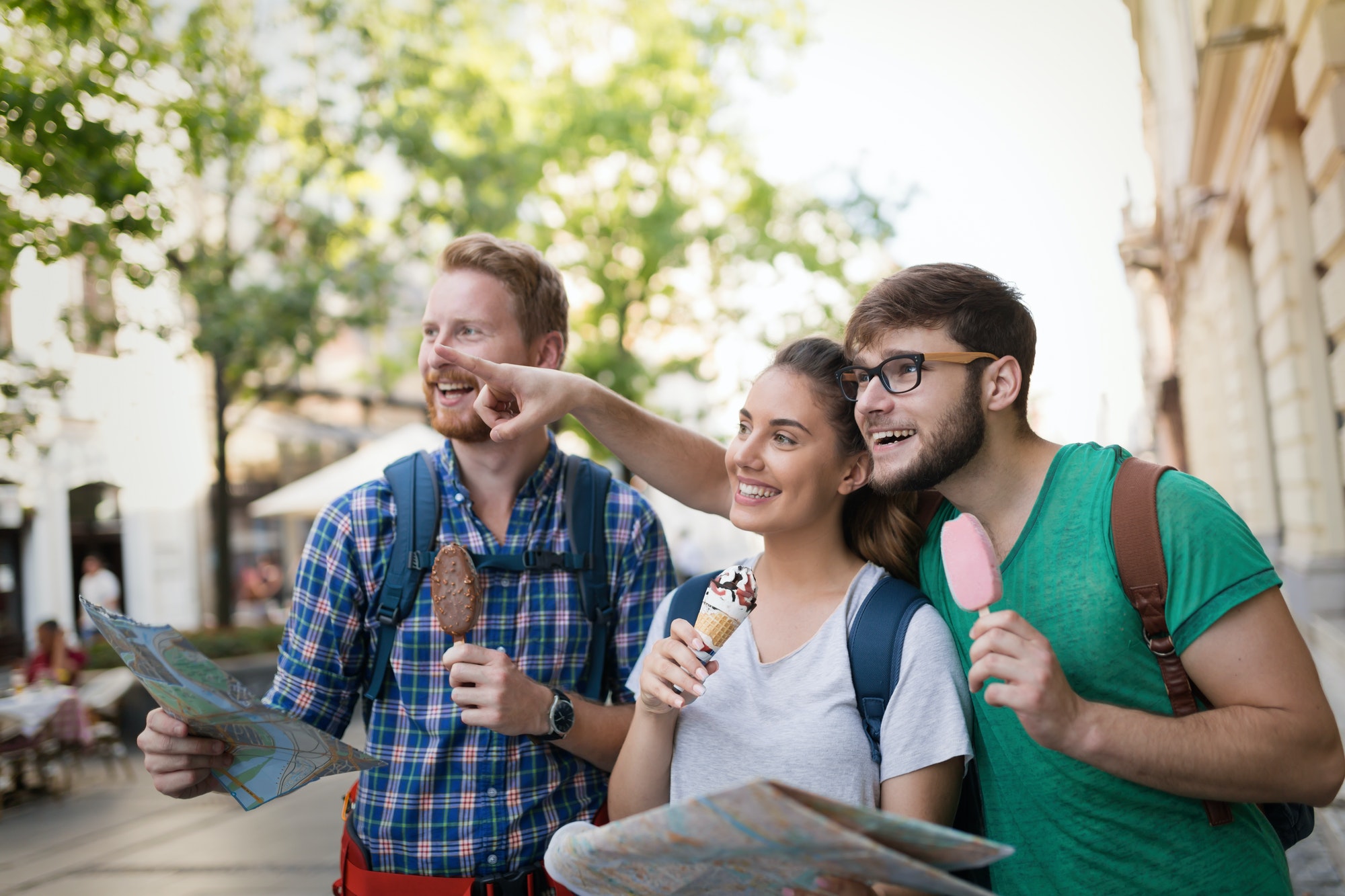 Happy group of tourists traveling and sightseeing